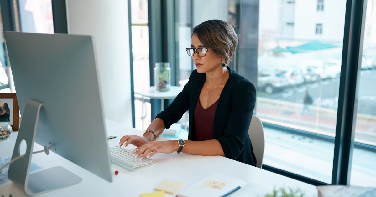 Woman working at computer in office